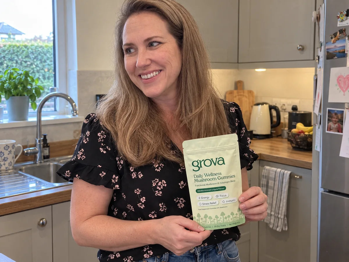 Illustrative scene of a woman holding a Grova pouch in her tidy kitchen